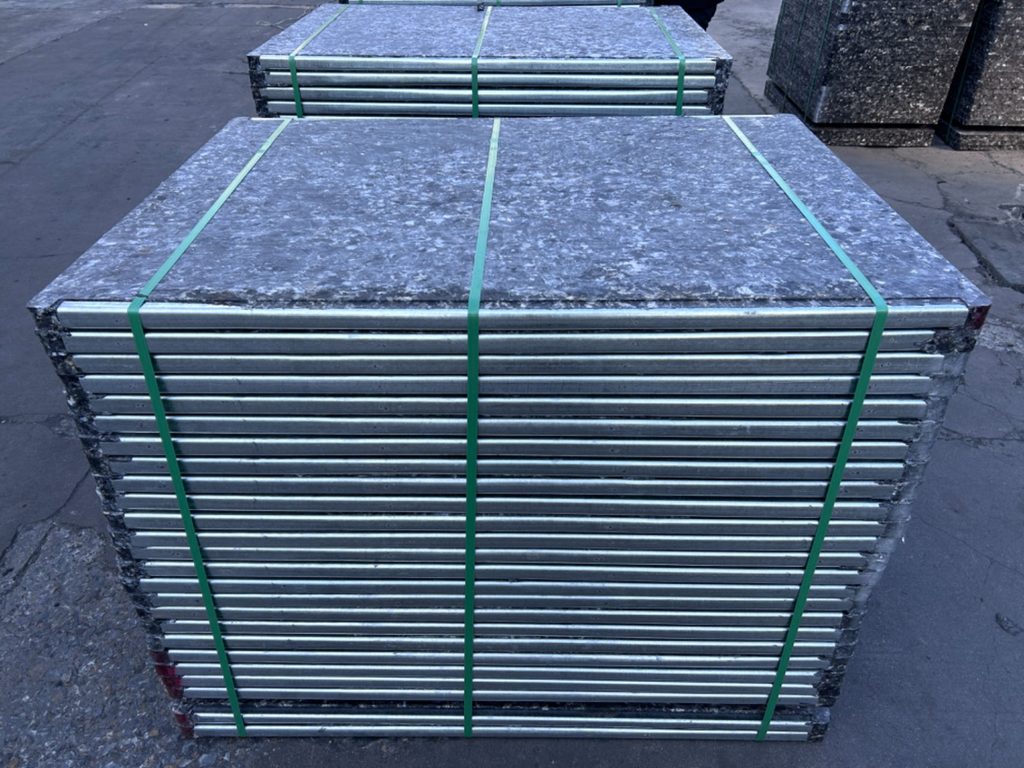GMT brick pallets stacked in industrial warehouse showing durability and quality
