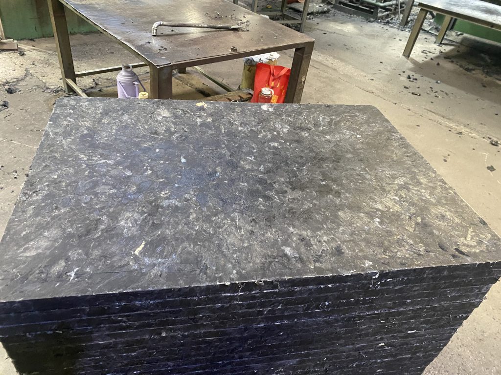 GMT pallet showing glass fiber reinforced thermoplastic composite structure in brick production facility