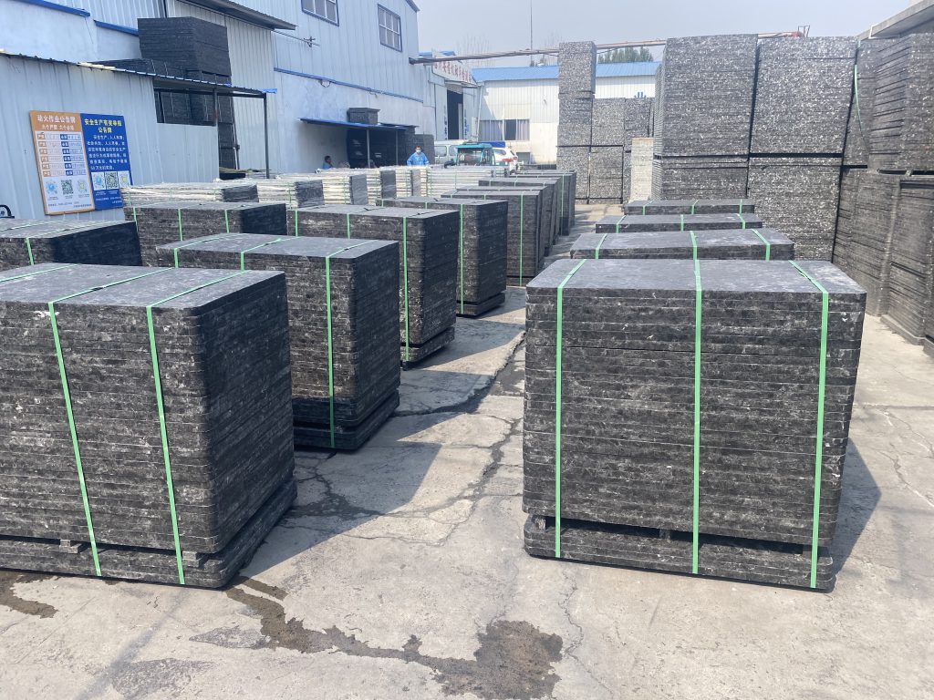 GMT pallets stacked in automated brick production facility showing dimensional consistency