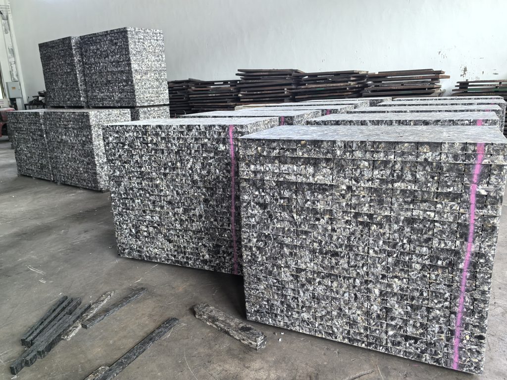 Robotic stacking system handling GMT pallets with precision